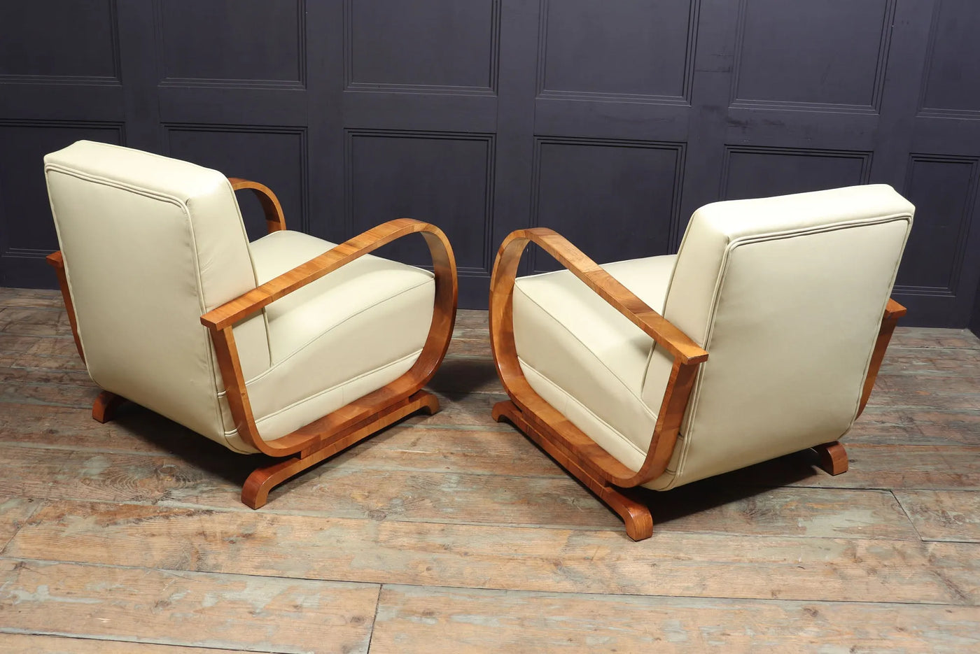 PAIR OF ART DECO LEATHER AND WALNUT ARMCHAIRS