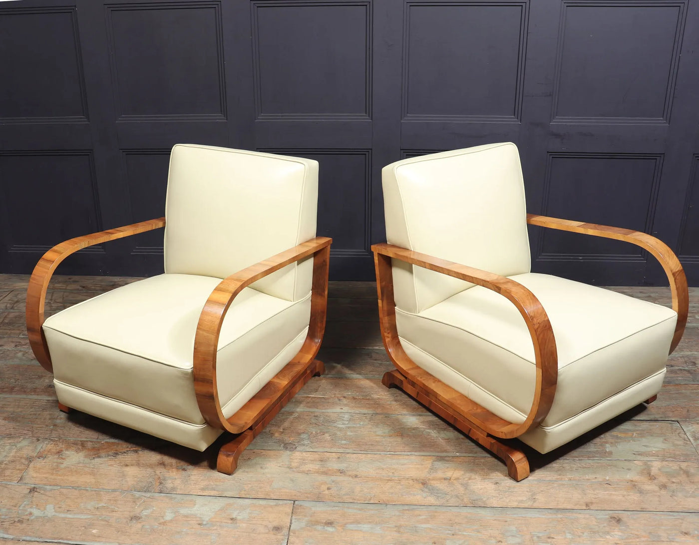 PAIR OF ART DECO LEATHER AND WALNUT ARMCHAIRS