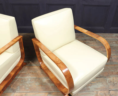 PAIR OF ART DECO LEATHER AND WALNUT ARMCHAIRS