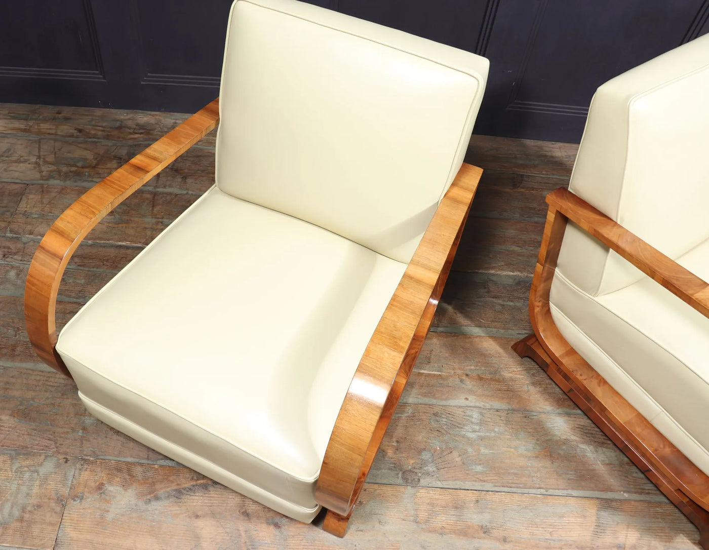 PAIR OF ART DECO LEATHER AND WALNUT ARMCHAIRS