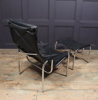 Mid Century Leather Armchair and stool by Hans Eichenberger