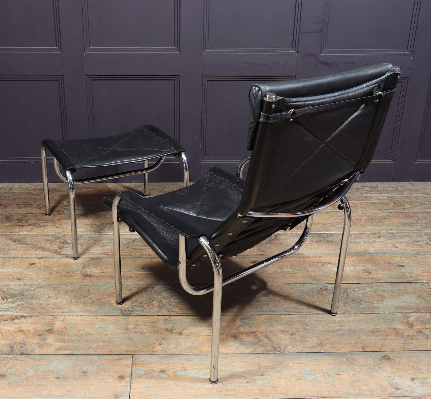 Mid Century Leather Armchair and stool by Hans Eichenberger