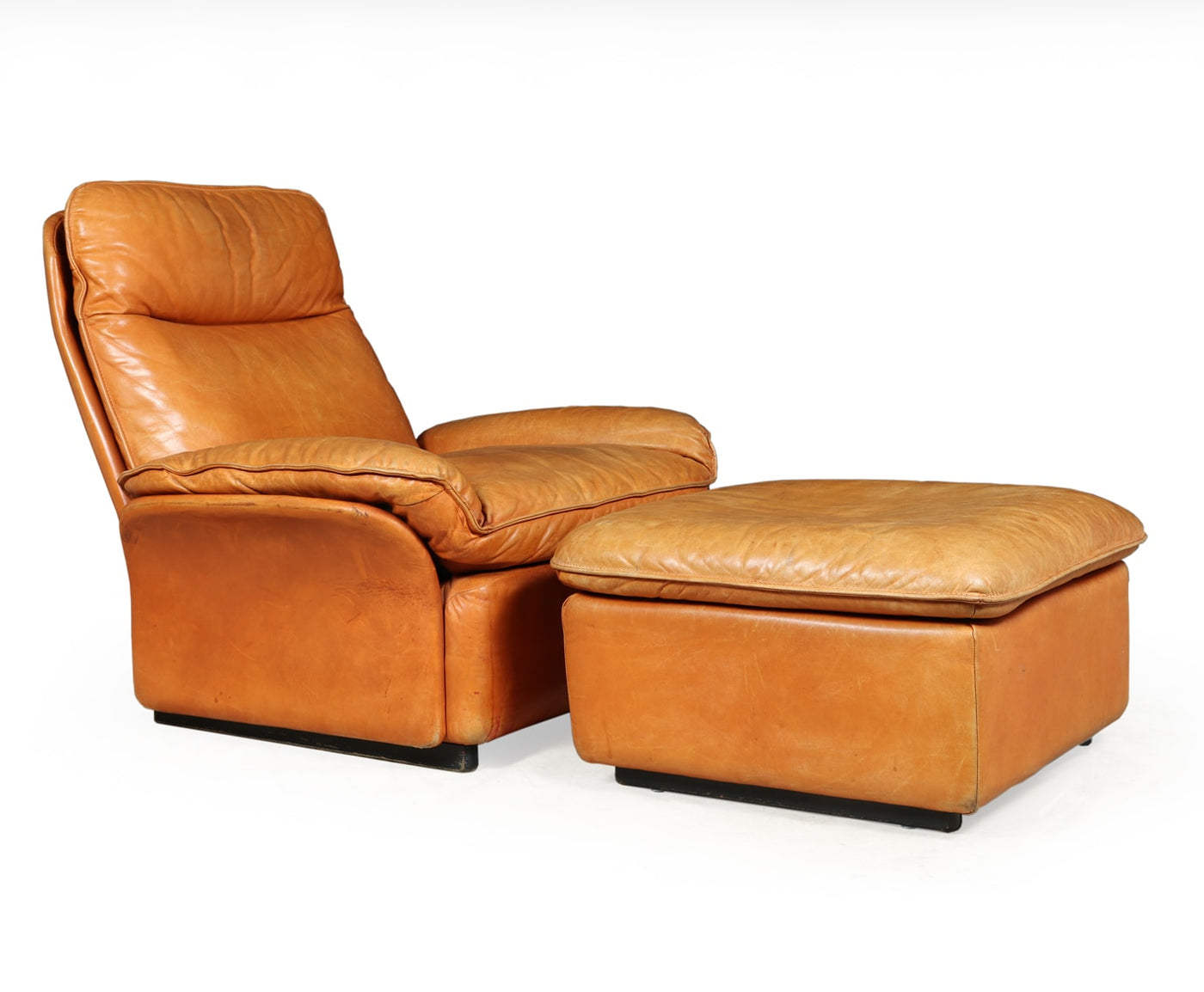 A De Sede Leather Armchair and Foot stool model DS49