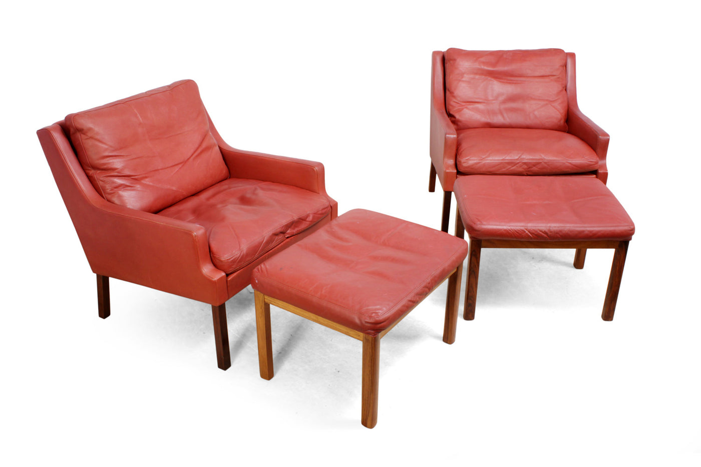Danish Lounge Chairs in red leather with Stools