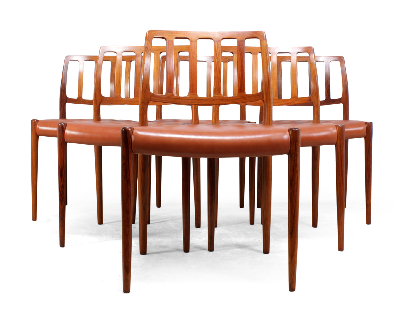 Mid Century Rosewood Dining Chairs by Moller model 83 This set of six model 83 dining chairs was designed by Niels O. Møller in Denmark, in 1974. they are in santos rosewood with new brown leather upholstery